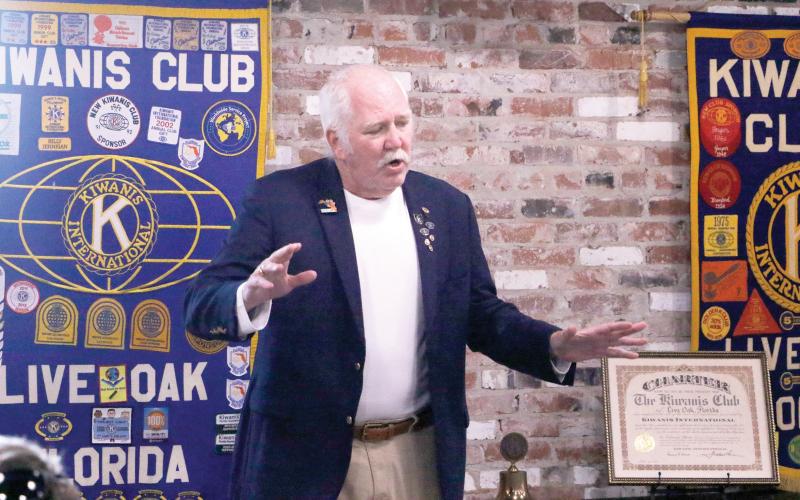 Kiwanis Club of Live Oak member Brantly Helvenston IV talks about the history of the club, which is celebrating its 100th year, during a celebration Friday at Heritage Park and Gardens. Helvenston’s grandfather and great-uncle were among the founding members. (JAMIE WACHTER/Lake City Reporter)