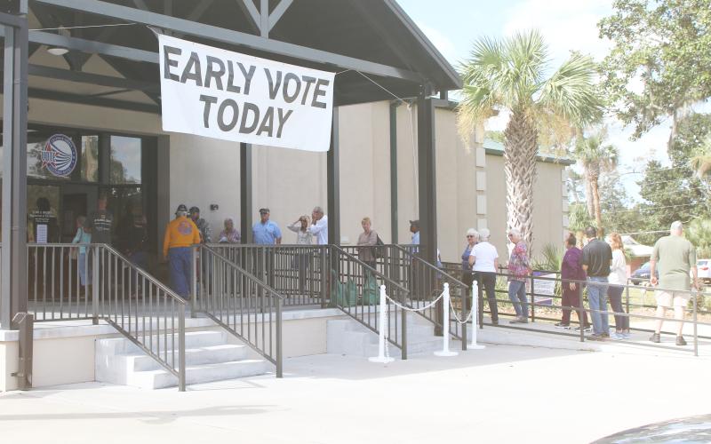Voters wait in line outside the Columbia County Supervisor of Elections office Monday for the start of early voting for the Nov. 5 general election. (TONY BRITT/Lake City Reporter)