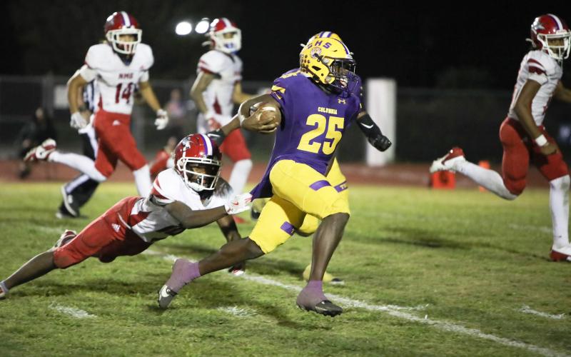 Columbia running back Jerome Horne races past a diving North Miami Beach defender on his way to the end zone for one of his three touchdowns in Friday’s 42-0 win. (BRENT KUYKENDALL/Lake City Reporter)