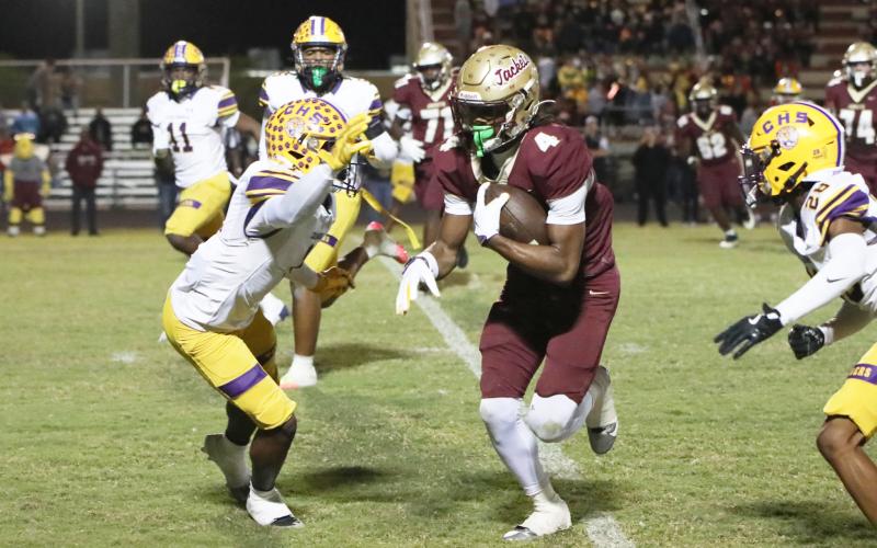 St. Augustine receiver Somourian Wingo runs past Columbia defensive back Zamarion Jones after a catch Friday night in a Region 1-4A quarterfinal. (BRENT KUYKENDALL/Lake City Reporter)