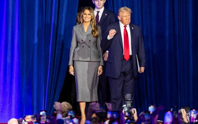 Republican presidential nominee former President Donald Trump arrives to his election night party alongside his wife, Melania Trump, and his son, Barron Trump, at the Palm Beach County Convention Center on Tuesday in West Palm Beach. (MATIAS J. OCNER/Miami Herald/MCT)