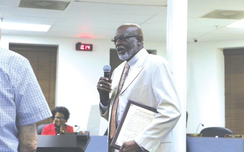 Lake City Councilman Jake Hill Jr. addresses the council after receiving a plaque for his years of service as a member of the Northeast Florida League of Cities board. (MORGAN MCMULLEN/Lake City Reporter)