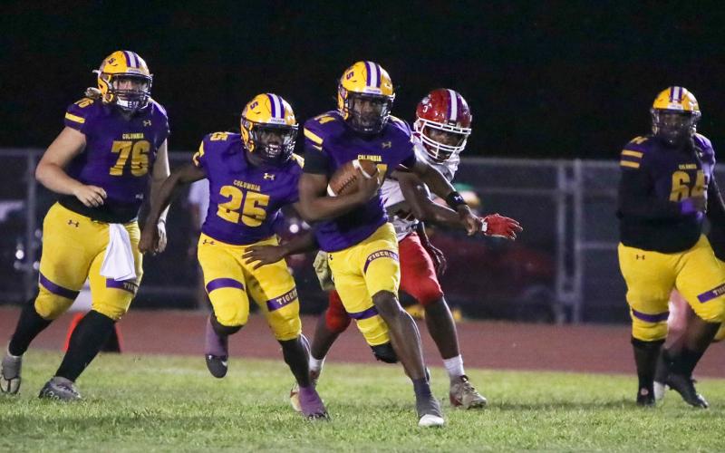 Columbia quarterback Xavier Collins scrambles up the field against North Miami Beach on Nov. 1. (BRENT KUYKENDALL/Lake City Reporter)