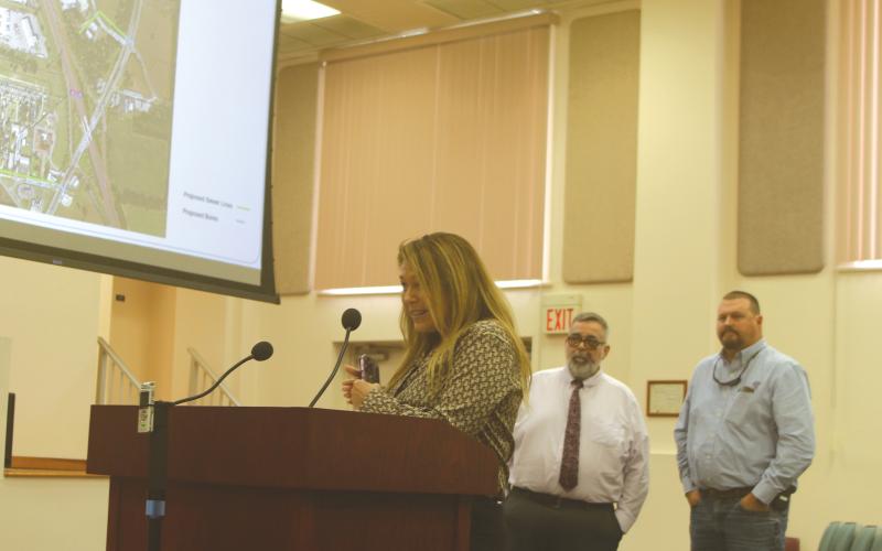 Debi Bennefield (left) speaks during Thursday’s county meeting alongside County Manager David Kraus and Lake City Executive Director of Utilities Steve Brown. (TONY BRITT/Lake City Reporter)