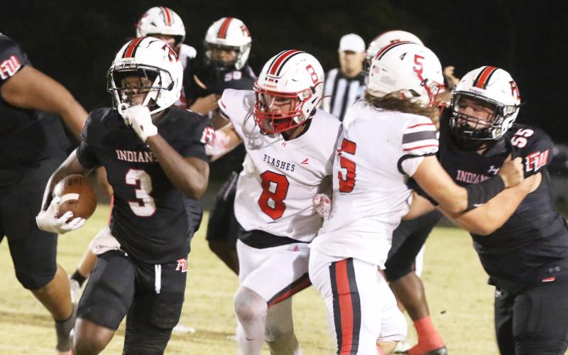 Fort White running back Elijah Gardner (3) burst up field against Hilliard on Oct. 25. (MORGAN MCMULLEN/Lake City Reporter)