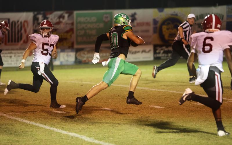 Suwannee safety Koy Frier returns an interception for a touchdown against Chiles last Friday. (PAUL BUCHANAN/Lake City Reporter)