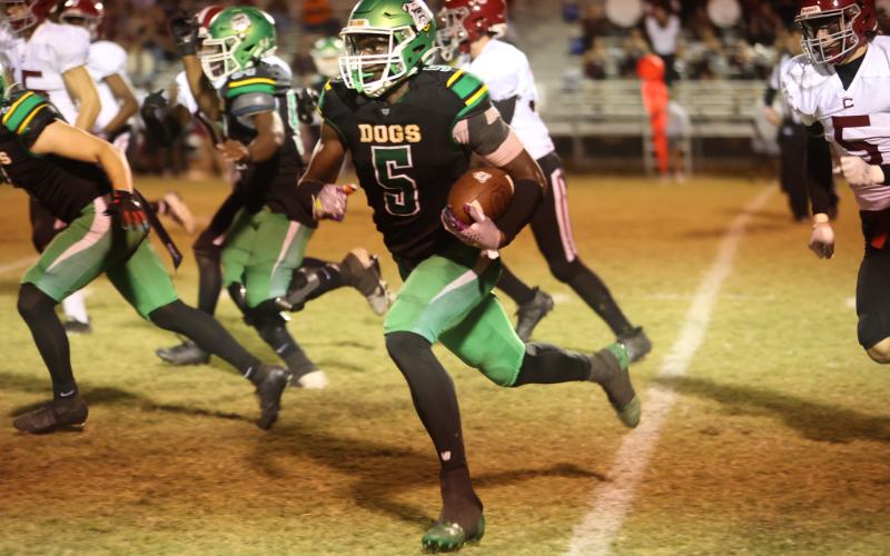 Suwannee receiver MJ Rossin runs up field against Chiles last Friday. (PAUL BUCHANAN/Lake City Reporter)