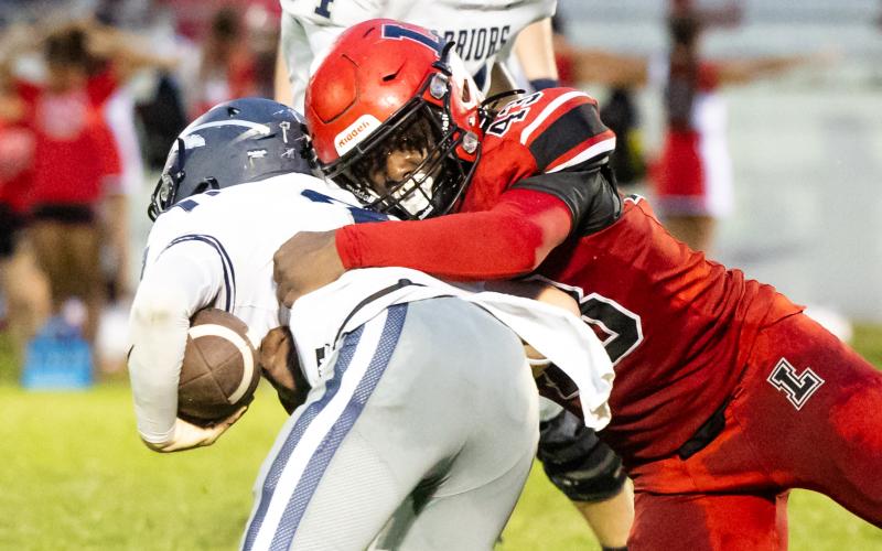 Lafayette defensive lineman Zamarion Hawkins makes a tackle against Brookwood on Sept. 6. (JACK HOWDESHELL/Lake City Reporter)
