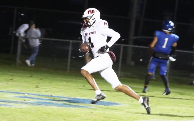 Fort White receiver Mike Peterson Jr. scores on a 14-yard touchdown pass in the third quarter of Friday’s playoff game against Jay. (MORGAN MCMULLEN/Lake City Reporter)