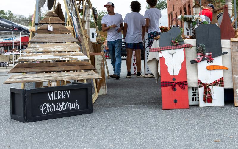 Handmade Christmas crafts adorn a booth at a previous Lafayette County Christmas festival around the courthouse square. The Mayo Christmas Market is set for 10 a.m. to 5 p.m. Saturday. (FILE)