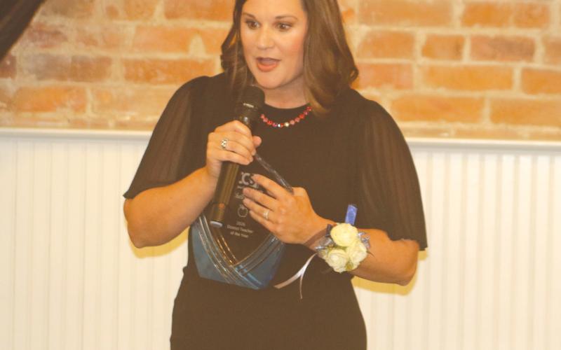 Westside Elementary School’s Shelly Teel speaks to the crowd after winning the Columbia County Teacher of the Year award. (TONY BRITT/Lake City Reporter)