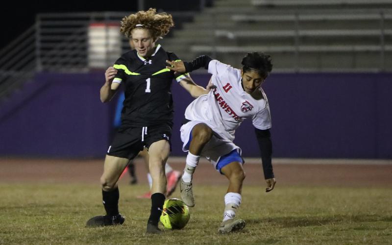 Columbia's Brendan Schwartz (left) and Lafayette's Elder Santiago (right) battle for possession of the ball on Dec. 2. (BRENT KUYKENDALL/Lake City Reporter)