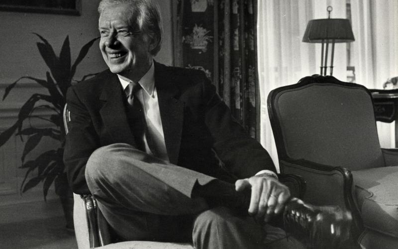 Jimmy Carter, smiling during a 1986 interview at the St. Regis Hotel in New York, died Sunday. He was 100.  (ED HILLE/TNS)