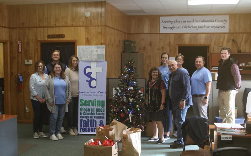 The Christian Service Center and volunteers from Gallagher Insurance provided food to nearly 200 people as part of the agency’s annual Christmas Basket distribution. (TONY BRITT/Lake City Reporter)