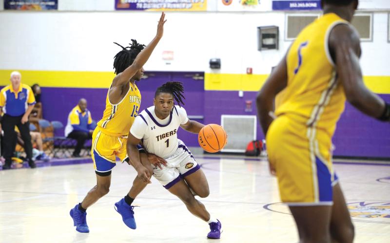 Columbia guard Zamarion Jones drives to the paint during last week’s game against Palatka. Jones and other veteran players will have to step up with forward Jalen Gaskins out for the remainder of the season. (BRENT KUYKENDALL/Lake City Reporter)