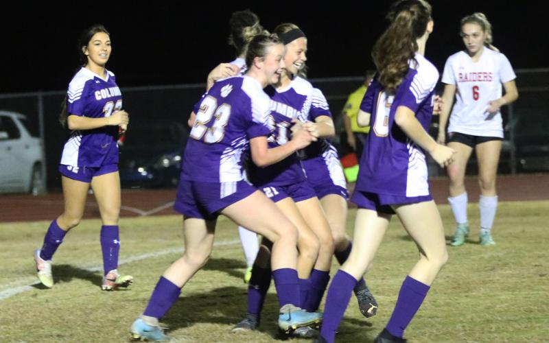 Columbia's Sydney Agner (23) celebrates with Laella Thompson after Thompson scored a goal against Santa Fe on Monday night. (JORDAN KROEGER/Lake City Reporter)