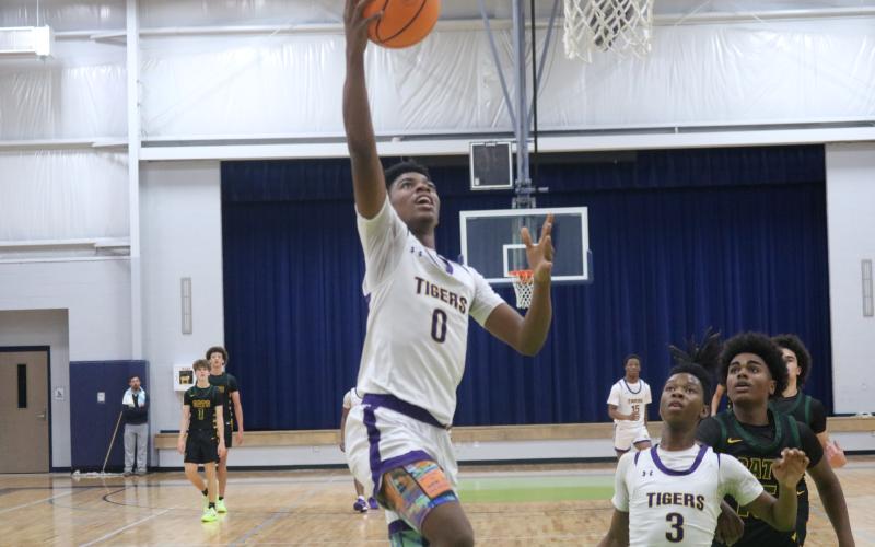 Columbia guard Murkail Cray makes a layup after coming away with a steal for the final points in a 41-36 win over Forest in the Hitchcock's Challenge championship on Sunday. (JORDAN KROEGER/Lake City Reporter)