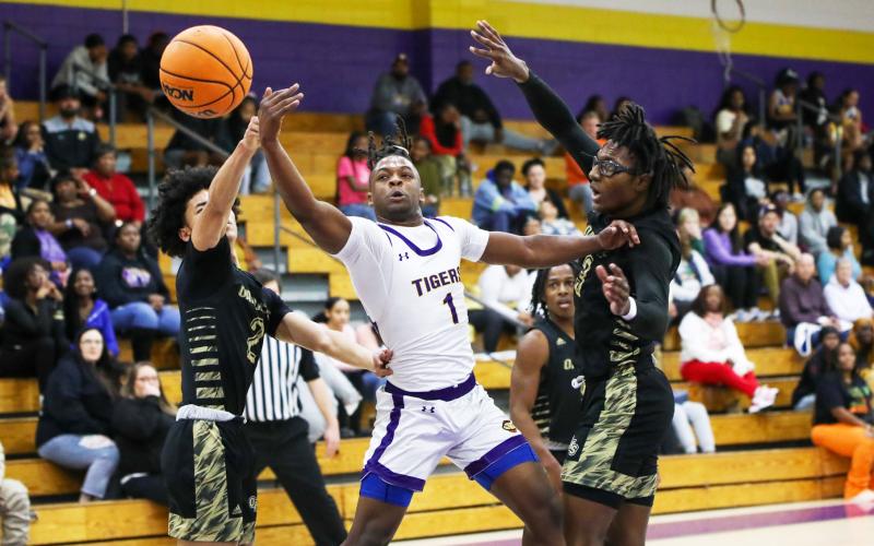 Columbia guard Zamarion Jones has the ball knocked away by Oakleaf guard Jarius Brown (2) on Friday night. (BRENT KUYKENDALL/Lake City Reporter)