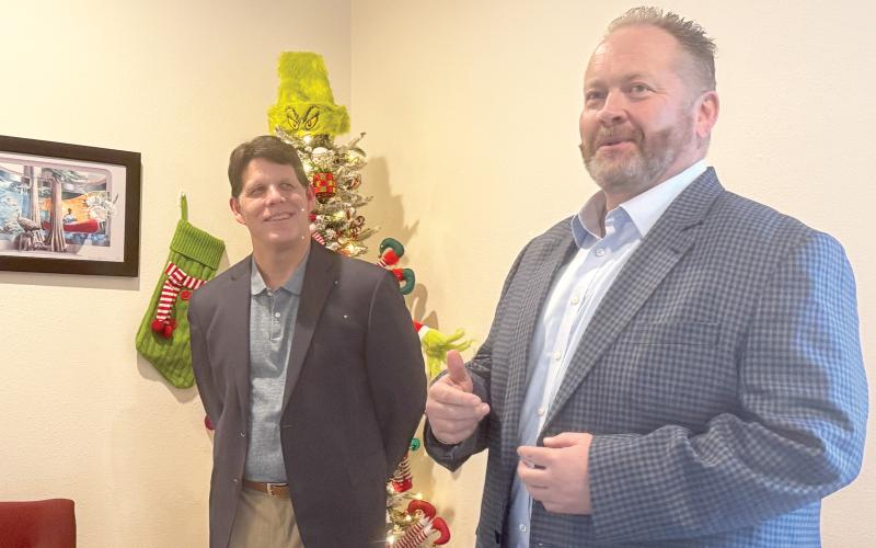 Lake City Reporter Publisher Todd Wilson (right) speaks Monday after Community Newspapers, Inc.  President Mark Major announced Wilson’s promotion to the company’s Southeast Regional Publisher. In his role, Wilson will also oversee the News-Leader of Fernandina Beach, the Nassau County Record of Callahan and the Tribune &amp; Georgian of St. Marys, Ga., in addition to the Reporter. Wilson will be based in Lake City. (JAMIE WACHTER/Lake City Reporter)
