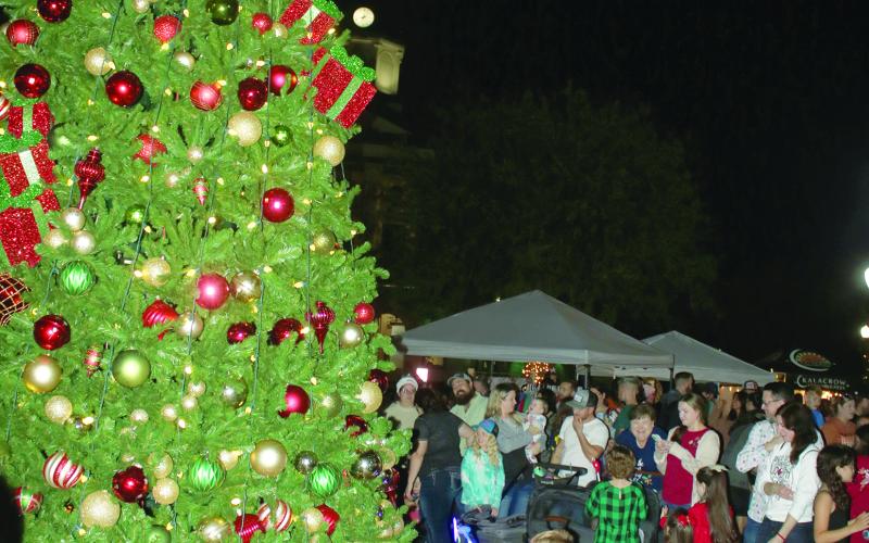 Hundreds attended last year’s Christmas tree lighting ceremony in Olustee Park. This year’s event is set for Sunday. (FILE)