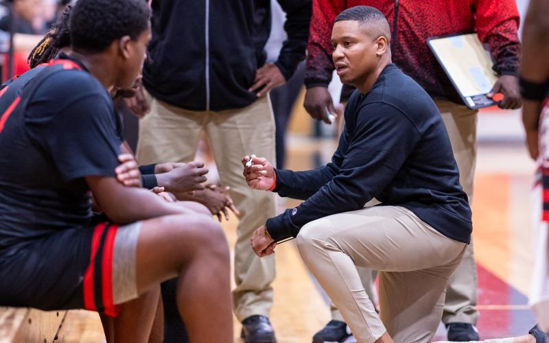Fort White coach Elven Sheppard talks to his team in a timeout during a game against Lafayette on Dec. 5. (JACK HOWDESHELL/Lake City Reporter)