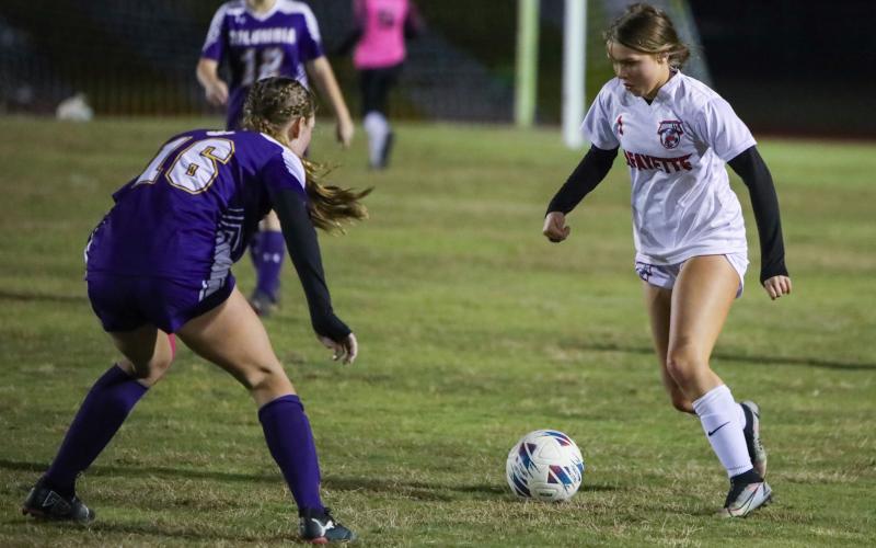 Lafayette's Carra Clark tries to get past Columba's Jenavieve Farer on Dec. 2. (BRENT KUYKENDALL/Lake City Reporter)