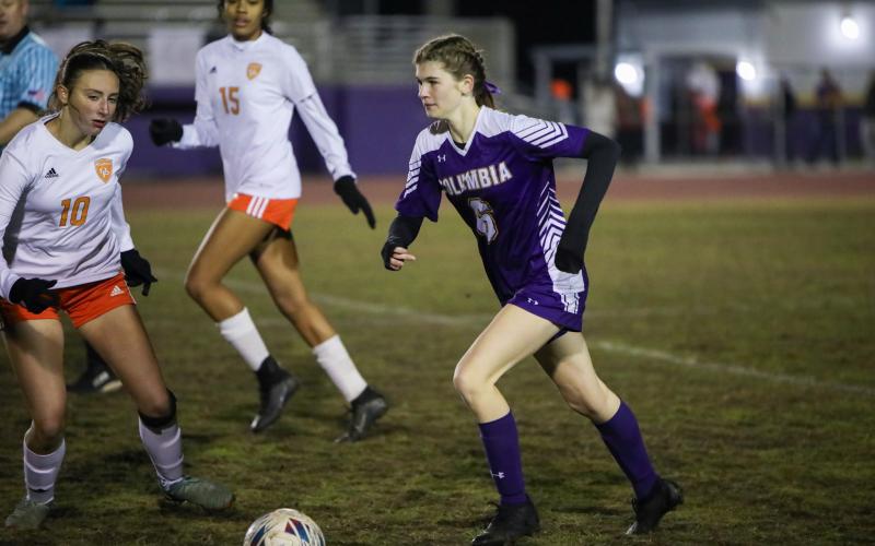 Columbia's Niki Sossie dribbles the ball up the field during a match against Orange Park on Jan. 9. (BRENT KUYKENDALL/Lake City Reporter)