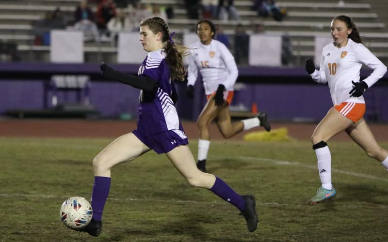 Columbia's Niki Sossie dribbles the ball up the field against Orange Park on Jan. 9. (BRENT KUYKENDALL/Lake City Reporter)