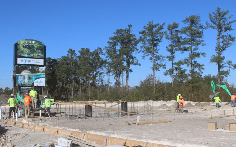 A crew works on the U-Haul storage facility site in the Gateway Crossing development Friday at the Interstate 75 and U.S. Highway 90 interchange. (TONY BRITT/Lake City Reporter)