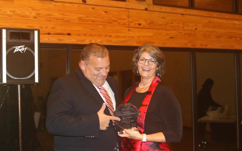 Branford High history teacher Karen Braun celebrates with her husband, Mike, after being named Suwannee County’s Teacher of the Year on Tuesday. (TONY BRITT/Lake City Reporter)