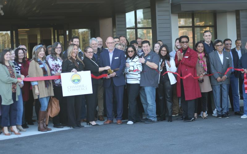 A crowd of area business owners, residents and local supporters attend the ribbon cutting ceremony for the Courtyard by Marriott on Tuesday afternoon. (TONY BRITT/Lake City Reporter)