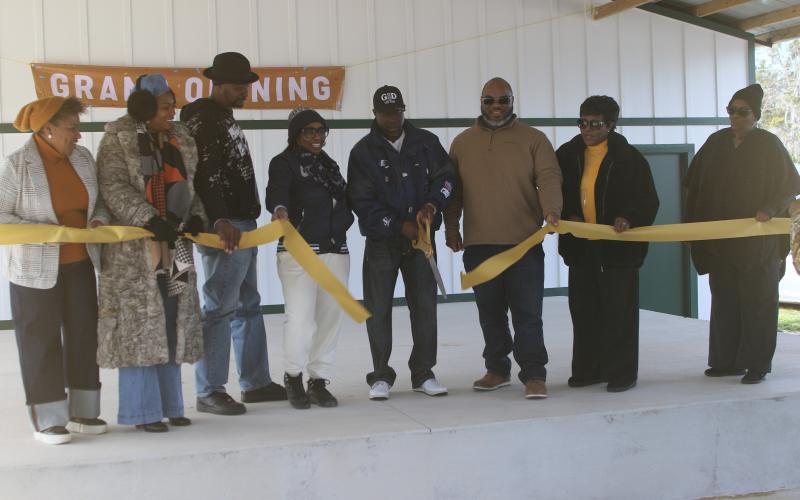 Members of the Annie Mattox Park board cut the ribbon during a grand opening for the Annie Mattox Park pavilion on Monday afternoon. (TONY BRITT/Lake City Reporter)