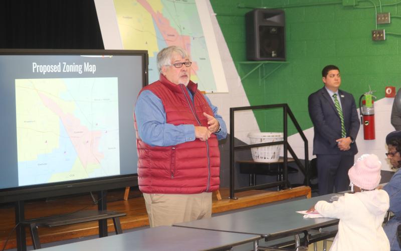 Superintendent Keith Couey discusses the new zoning proposal at a town hall meeting Tuesday at Five Points Elementary. (TONY BRITT/Lake City Reporter)