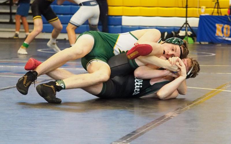 Suwannee’s Arthur Vanderpool wrestles against St. John Neumann’s Landon Lewis during the Class 1A state duals semifinals on Saturday. (DEE DEE JOLICOEUR/Special to the Reporter)