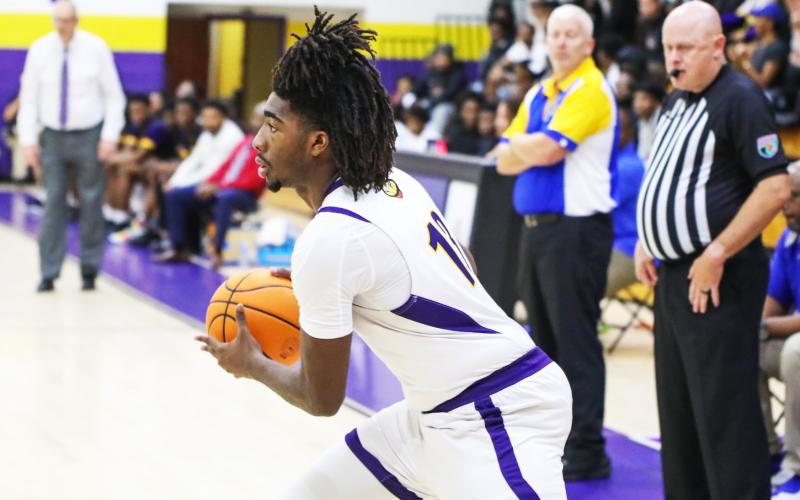Columbia forward Zavian Douglas looks to pass against Palatka on Dec. 18. (BRENT KUYKENDALL/Lake City Reporter)