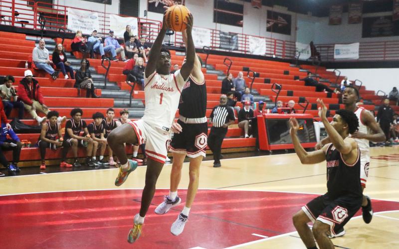 Fort White guard Jayden Jackson rises for a shot against Middleburg on Monday. (MORGAN MCMULLEN/Lake City Reporter)