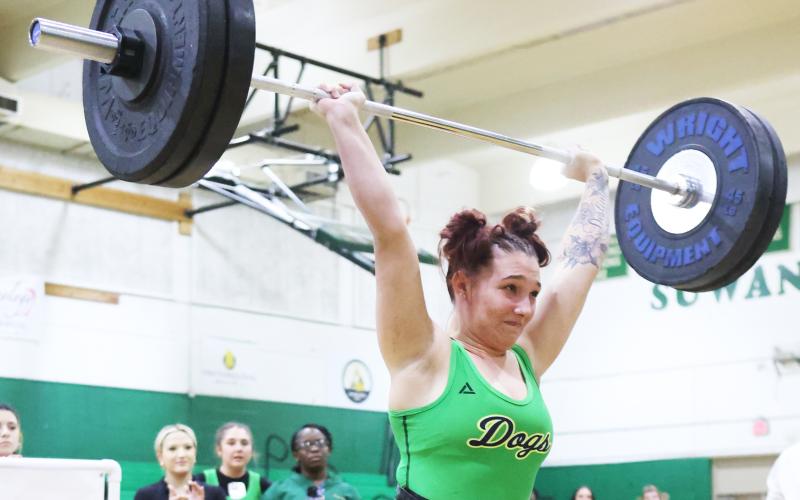 Suwannee lifter Katherine Lansford completes her clean and jerk attempt at the District 4-1A meet on Jan. 24. (PAUL BUCHANAN/Lake City Reporter)