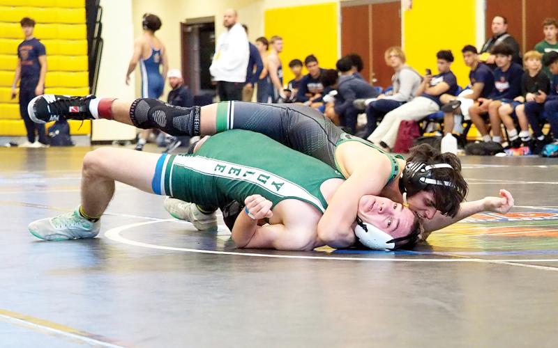 Suwannee’s Jose Garcia pinned Yulee’s Ethan McFeely at 144 pounds during the Region 1-1A duals championship match at the state duals meet. (DEE DEE JOLICOEUR/Special to the Reporter)