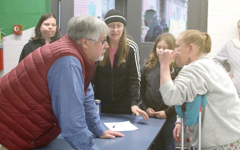 Columbia County Superintendent Keith Couey discusses the closure of Five Points Elementary School and the new proposed zoning for elementary school students with parents and community members Tuesday at a town hall meeting. (TONY BRITT/Lake City Reporter)