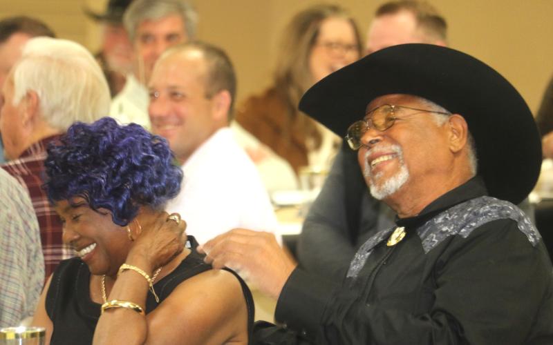 Ron and Gwendolyn Williams laugh during Thursday’s retirement celebration in honor of Ron Williams’ 43 years as a county commissioner. (TONY BRITT/Lake City Reporter)