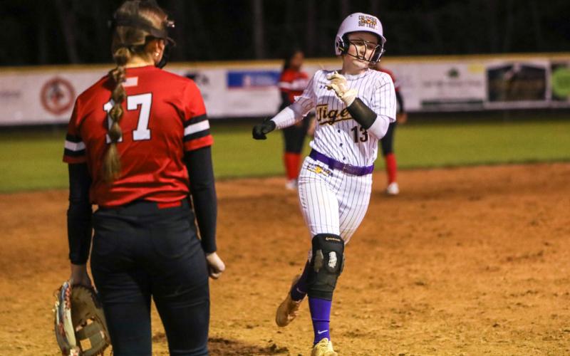 Columbia second baseman Anna Dansby rounds third base after Emily Delgado hit a home run against Baker County on Thursday night. (BRENT KUYKENDALL/Lake City Reporter)