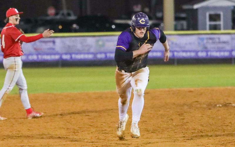 Columbia first baseman Max Schuler races to third base during Thursday's game against Bishop Snyder. (BRENT KUYKENDALL/Lake City Reporter)