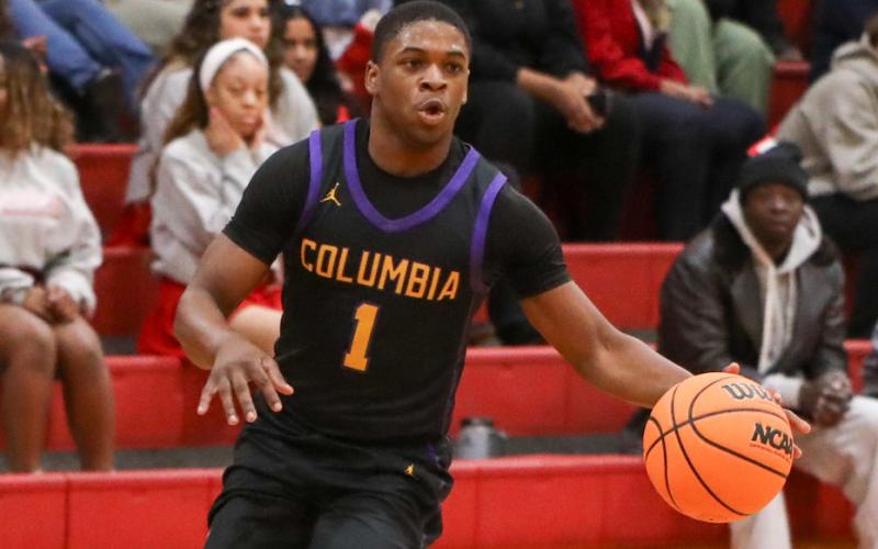 Columbia guard Zamarion Jones dribbles up the court against Santa Fe on Jan. 24. (BRENT KUYKENDALL/Lake City Reporter)