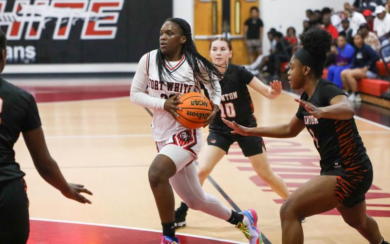 Fort White guard Zuri Hollie drives to the basket against Trenton during the Region 3-R semifinals on Thursday night. (BRENT KUYKENDALL/Lake City Reporter)