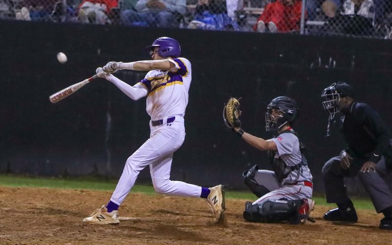 Columbia outfielder Bynton Edge hits a single against Santa Fe on Tuesday night. (BRENT KUYKENDALL/Lake City Reporter)