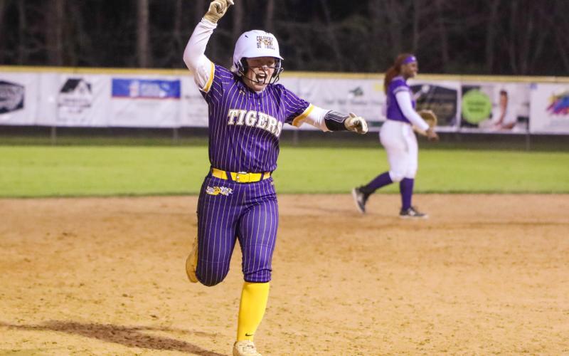 Columbia third baseman Alex Collins celebrates rounding third base after hitting a walk-off home run against Gainesville on Tuesday. (BRENT KUYKENDALL/Lake City Reporter)