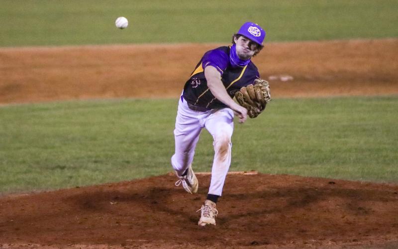 Columbia pitcher Bynton Edge hurls to the plate against Bishop Snyder on Feb. 20. (BRENT KUYKENDALL/Lake City Reporter)