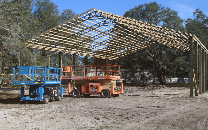 The pole barn at Cooper’s Hideout, which will cover a food truck area, a stage and gaming tables, is nearing completion. Eric Levy, the site’s owner, said the roof could be on the barn by the end of the week. (TONY BRITT/Lake City Reporter)