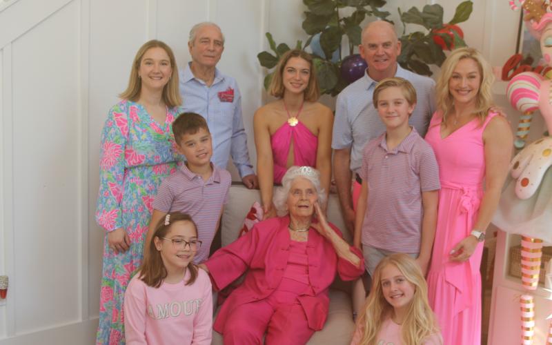 Helena Powers celebrated her 109th birthday this weekend with a party with friends and family. Pictured with Powers during the celebration are Madeleine Johnson (bottom row, from left) and Claire Walsh; Everett Johnson (middle row, from left), Powers, Carson Powers and Allison Powers; and Jessica Johnson (back row, from  left), Frank Powers, Aspen Powers and John Walsh. (TONY BRITT/Lake City Reporter)