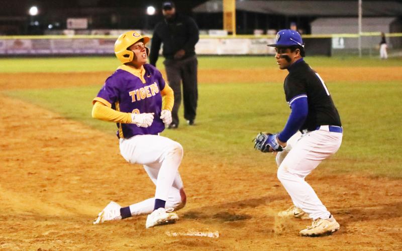 Columbia right fielder Tison McCray lets out a roar at third base after hitting a triple against Bartram Trail on Friday night. (BRENT KUYKENDALL/Lake City Reporter)